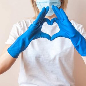 A,Female,Doctor,In,Blue,Medical,Gloves,,White,T-shirt,And